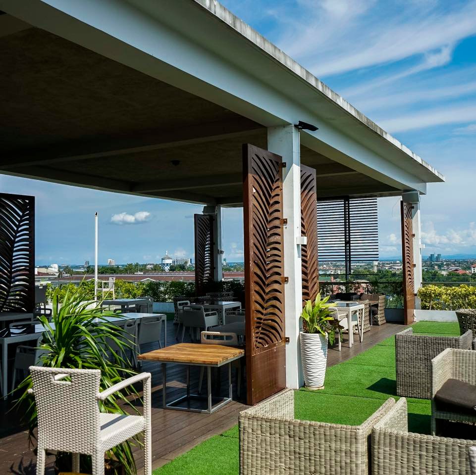 Outdoor terrace with cozy furnitures on a rooftop restaurant