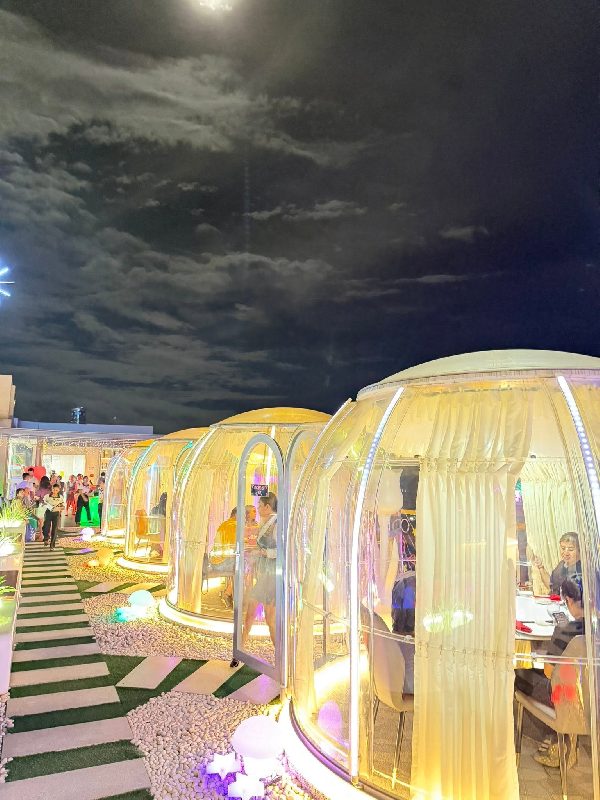 Dining domes seen from the outside at night time