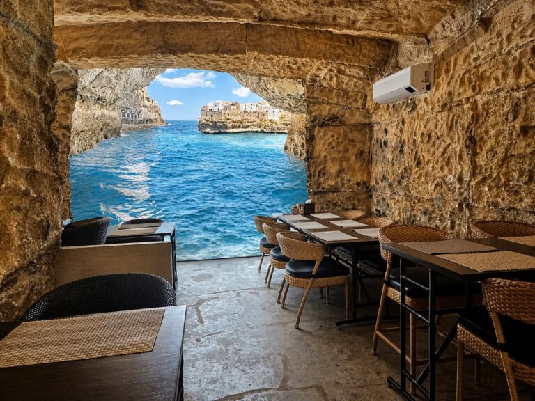 Inside a restaurant that looks like cave with a seaview